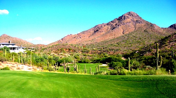 Golf course fairway with desert mountain backdrop