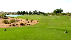 Golf course fairway with pond and sand
